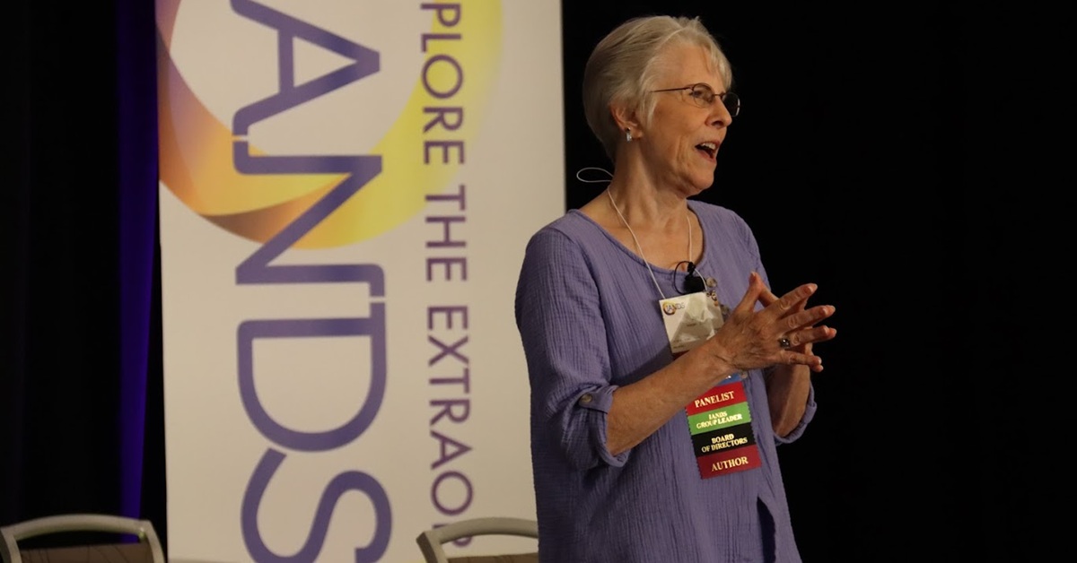 Iands president jan holden speaking at iands conference 2025. The event was recently featured in a new york times opinion essay.